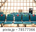 social distancing seats at airport's gate 78577366