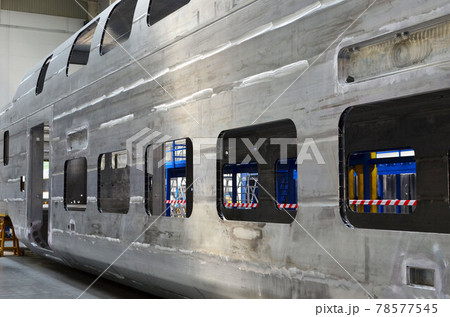 Inside of the rail car assembly plant. Industrial workshop for welding aluminum bodys.  78577545