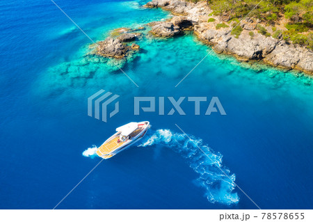 Speed boat in blue sea at sunrise in summer. Aerial view Speed boat in blue sea at sunrise in summer. Aerial view 78578655