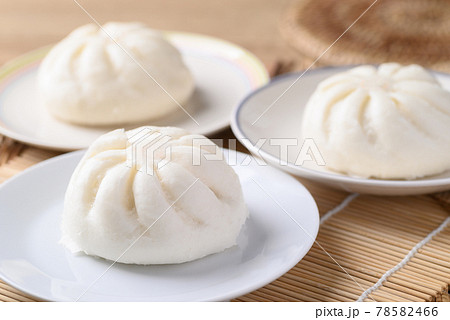 Steamed bun stuffed with minced pork on white plate, Asian food 78582466