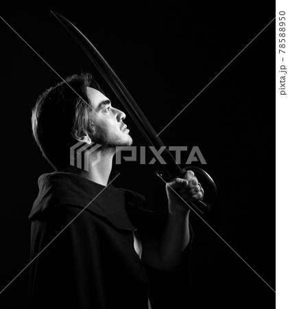 Black and white portrait of adult man in cape Black and white portrait of adult man in cape 78588950