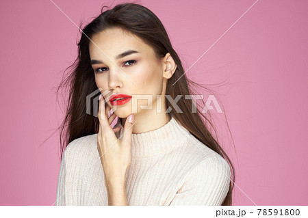 Beautiful brunette red lips white blouse close-up attractive view pink background 78591800
