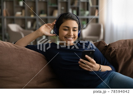 Satisfied young indian woman client enjoy easy learning foreign language Satisfied young indian woman client enjoy easy learning foreign language 78594042