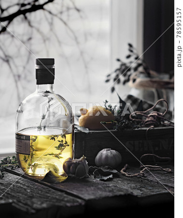 food photography of a bottle of vegetable oil side view on a wooden table on the background of the window in the back light in the style of Provence close up 78595157