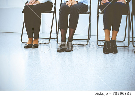 Group of business people sitting in office and waiting for job interview while using gadgets. Conference or training concepts 78596335