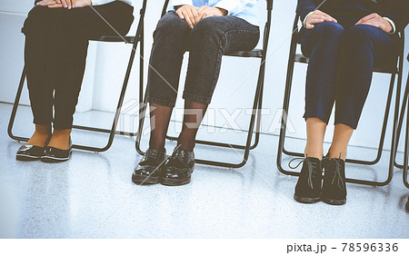 Group of business people sitting in office and waiting for job interview while using gadgets. Conference or training concepts Group of business people sitting in office and waiting for job interview while using gadgets. Conference or training concepts 78596336