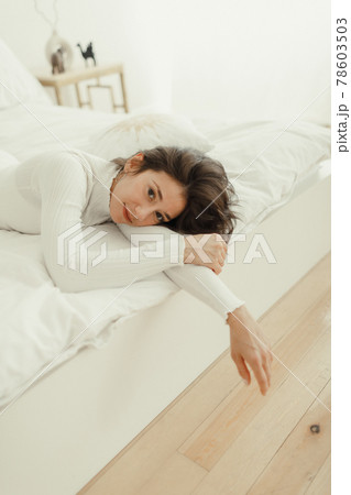 Yoga at home. Keep calm. women resting on bed after yoga workout 78603503