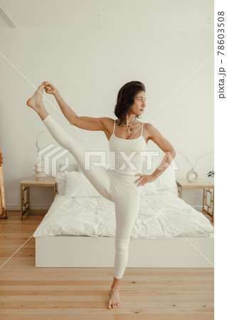 Yoga at home. woman does exercises and yoga in the morning. Healthy lifestyle Yoga at home. woman does exercises and yoga in the morning. Healthy lifestyle 78603508