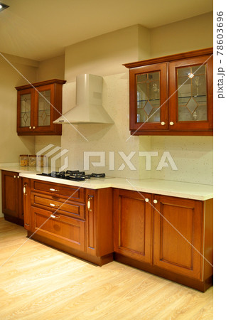 Interior of modern kitchen equipment, walnut cabinets Interior of modern kitchen equipment, walnut cabinets 78603696