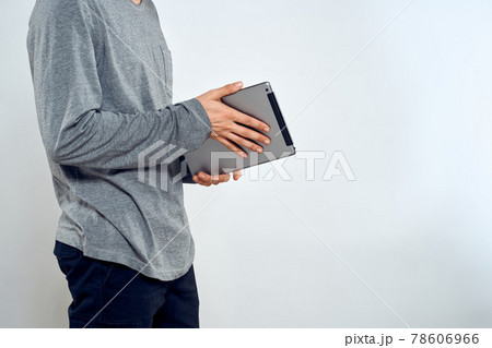 Man with tablet in hands technology lifestyle internet communication work light background cropped view 78606966