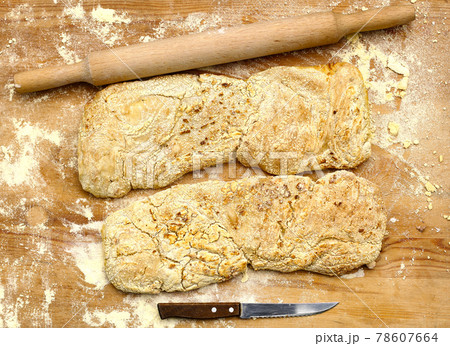 two ciabatta bread loaf fresh bake close up photo on kitchen board two ciabatta bread loaf fresh bake close up photo on kitchen board 78607664