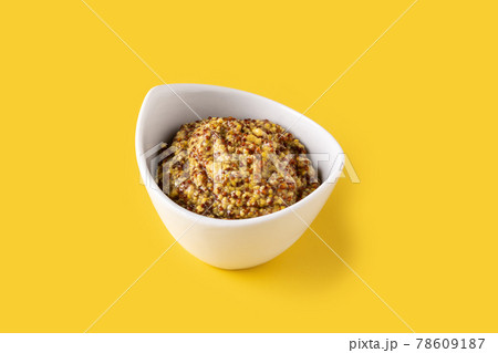 Mustard sauce in white bowl 78609187