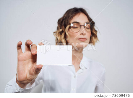 Business woman in shirt with business card in hand mockup 78609476