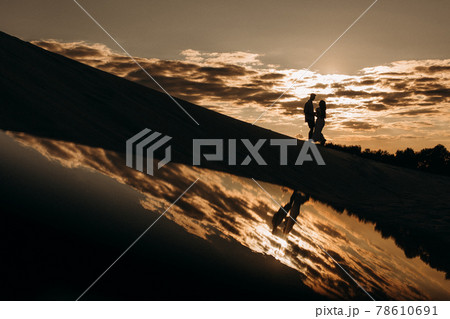 love couple activity sandy desert sunset reflection love couple activity sandy desert sunset reflection 78610691