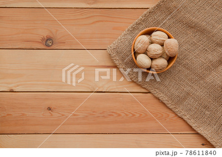 Tasty wallnuts mix on a wooden table. 78611840