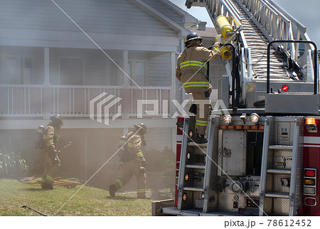 fire extinguisher firefighter department working under smoke 78612452
