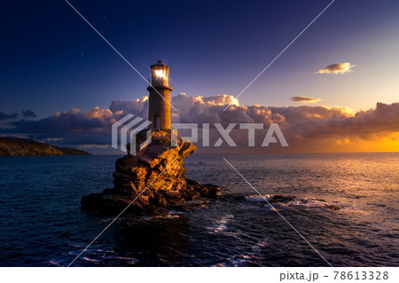 The beautiful Lighthouse Tourlitis of Chora at night. Andros island, Cyclades, Greece 78613328
