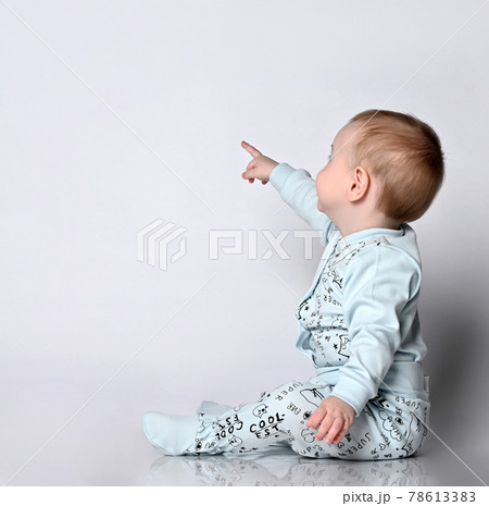 side view of pretty crawling baby 78613383