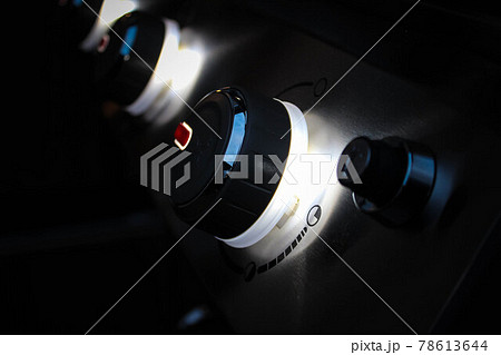 Close view of barbecue gas grill in stainless steel. Close-up BBQ Gas stove knob. Close view of barbecue gas grill in stainless steel. Close-up BBQ Gas stove knob. 78613644