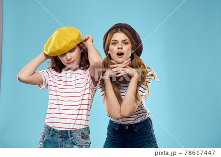 funny mom and daughter fashion studio lifestyle fun blue background family 78617447