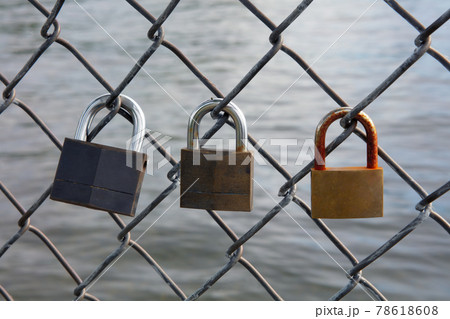 lock love padlock forever metal fence threesome 78618608