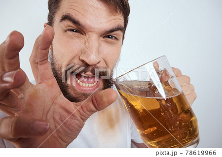 emotional man with a large mug of beer alcoholic drink gesturing with his hands drunken state emotional man with a large mug of beer alcoholic drink gesturing with his hands drunken state 78619966