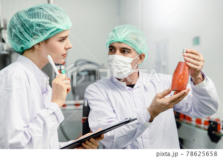 Quality control and food safety team inspection the product standard in the food and drink factory production line. Quality control and food safety team inspection the product standard in the food and drink factory production line. 78625658