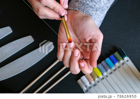 Work at home with nails. Nail care, Self care. Female manicure. Do manicure by yourself while staying at home. Female hands and manicure tools 78626950