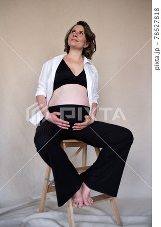 Pregnant caucasian woman touching her belly. Waiting for baby Pregnant caucasian woman touching her belly. Waiting for baby 78627818