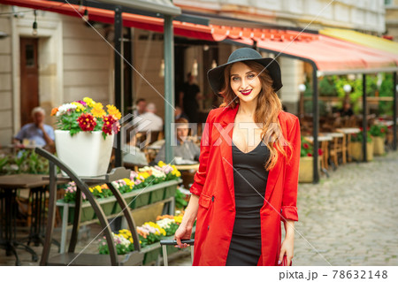 Woman is posing in the city street Woman is posing in the city street 78632148