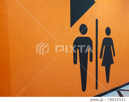 Toilet wc restroom sign man and woman icon graphic on orange wall. 78633521