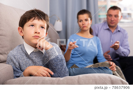 Portrait of upset boy scolded by parents at home 78637906