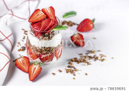 Strawberry parfaits made with fresh fruit, yogurt ang granola 78639691