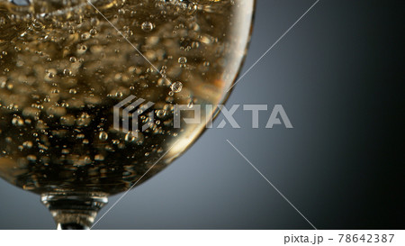Detail of pouring white wine into glass Detail of pouring white wine into glass 78642387