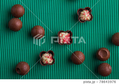Top view flat lay assortment of various sweet chocolate candies. 78643976