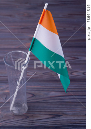 Close-up the flag of India in a transparent glass vase. 78644316