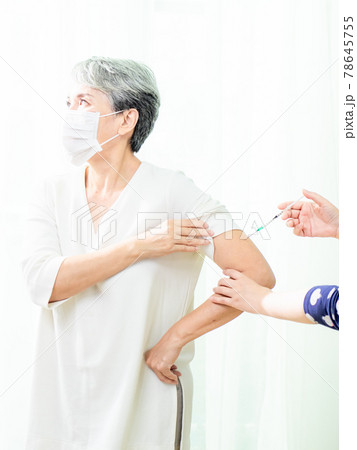 Senior asian woman receiving the injection of the coronavirus vaccine by a doctor to receive the antibodies, immunize the population. Senior asian woman receiving the injection of the coronavirus vaccine by a doctor to receive the antibodies, immunize the population. 78645755