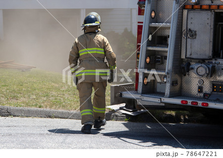 fire extinguisher firefighter department working under smoke 78647221
