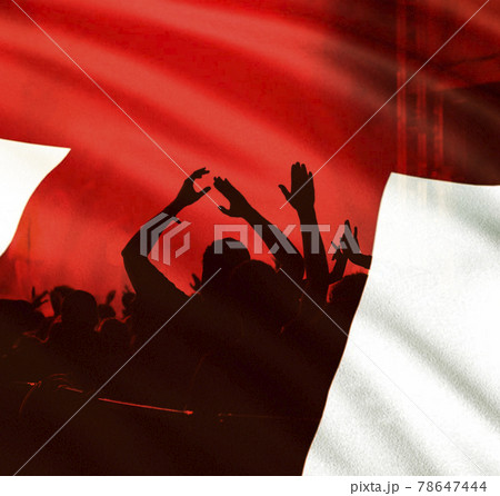 football fans supporting England - crowd celebrating in stadium with raised hands against England flag football fans supporting England - crowd celebrating in stadium with raised hands against England flag 78647444