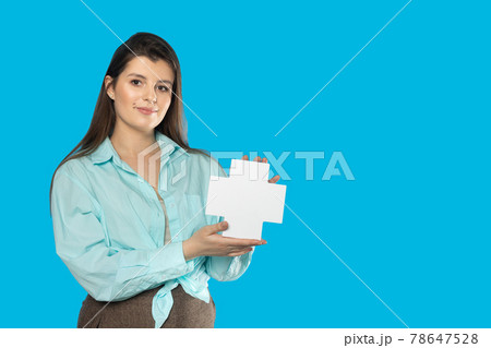 The girl holds a plus sign in her hands which means adding but also a cross and may mean health or humanitarian aid. 78647528