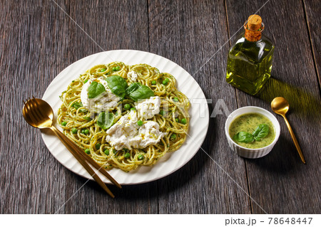 pesto spaghetti with green peas and burrata cheese 78648447