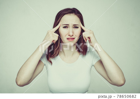 Portrait of a girl in a white T-shirt suffering from psychological pressure and criticism of society. Toned. Portrait of a girl in a white T-shirt suffering from psychological pressure and criticism of society. Toned. 78650682