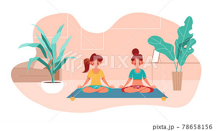 Fitness at home. Two girl do yoga in lotus pose 78658156