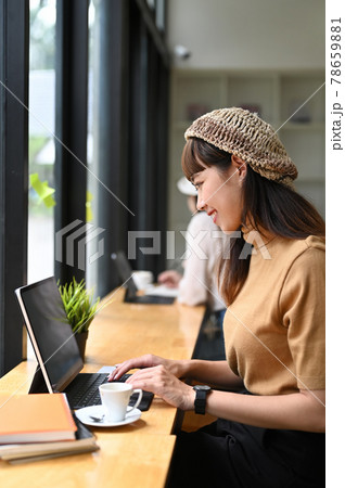 Portrait of female office worker working with laptop in meeting room. Portrait of female office worker working with laptop in meeting room. 78659881