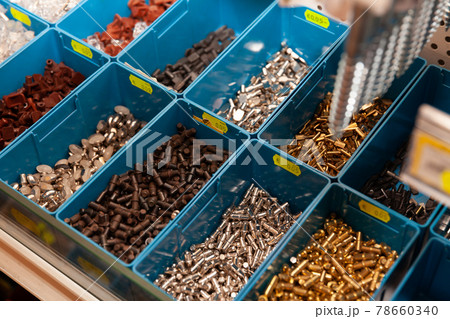 Boxes with furniture accessories in a hardware store 78660340