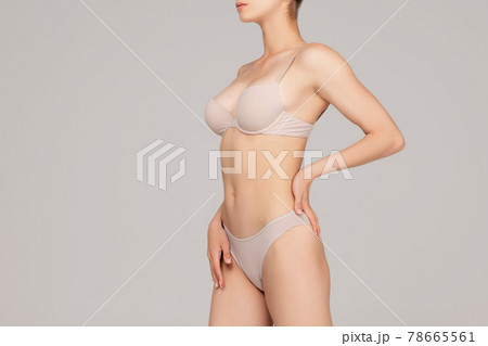 Perfect slim toned young body of the girl or fit woman at studio. The fitness, diet, sports, plastic surgery Perfect slim toned young body of the girl or fit woman at studio. The fitness, diet, sports, plastic surgery 78665561