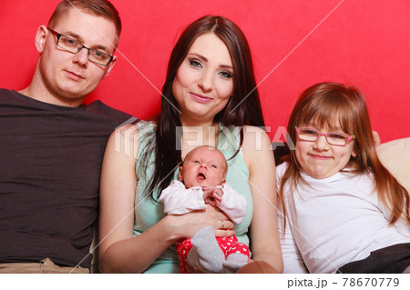Family photo of mother, baby, daughter and father 78670779