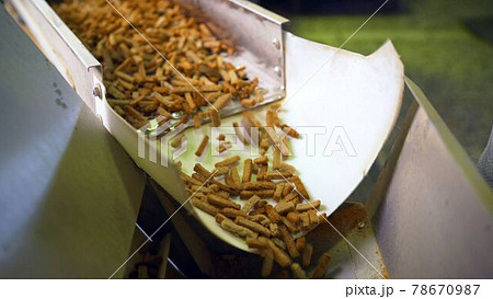 Crackers in production. a factory for the production of rusks from bread. Bread on the conveyor. Crackers production. 78670987