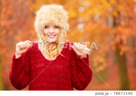 Portrait of pretty smiling woman in fur winter hat Portrait of pretty smiling woman in fur winter hat 78671540