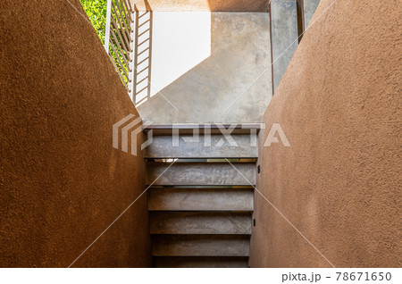 Cement stairs with sunlight in soil wall Cement stairs with sunlight in soil wall 78671650